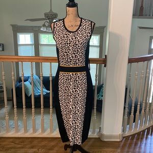 New- Women’s sweater dress - Black yellow and cheetah print.